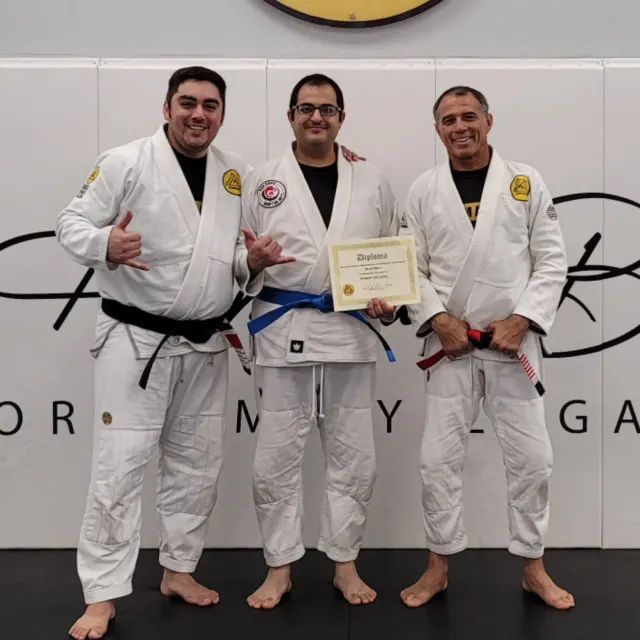 Coach Robert De leon Promotion to blue belt at a seminar with Master Royler Gracie